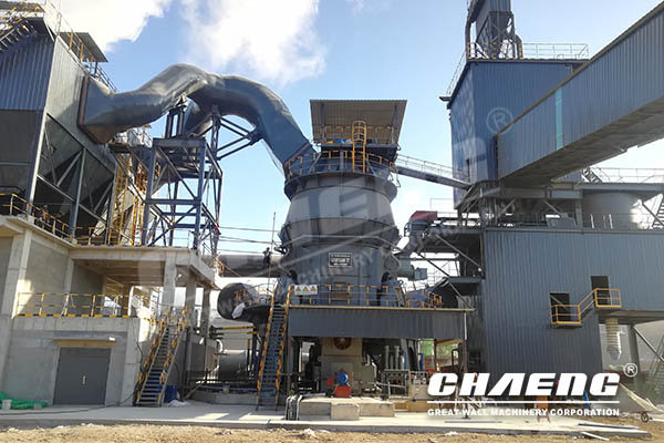 How does the vertical roller mill realize grinding?